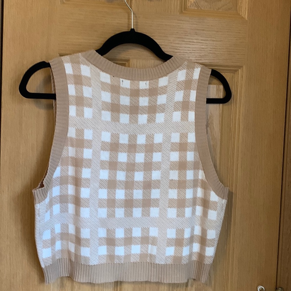 Large tan and white checkered sweater vest. The brand is nikka k.